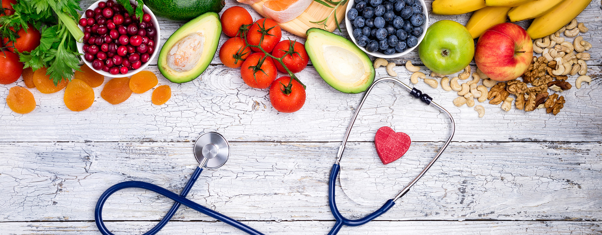 Stock image of healthy foods on table with stethoscope