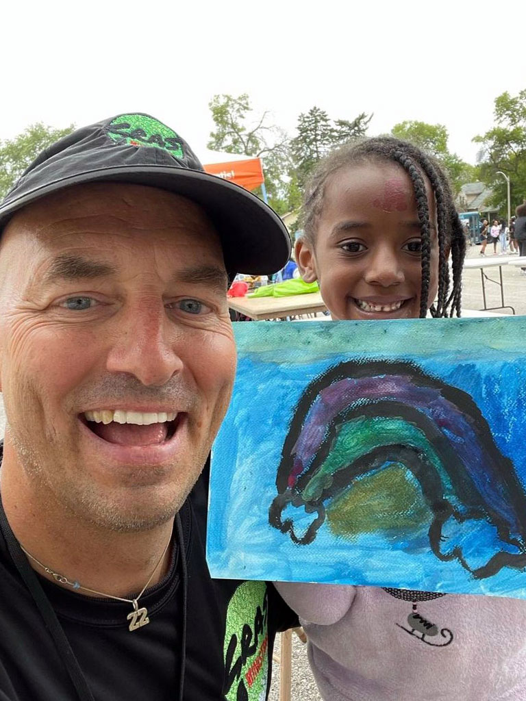 Lance with a child and painting